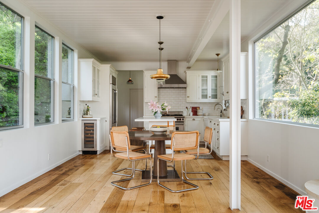 2355 Hermits Glen Los Angeles, CA 90046 - Photo 11 of 45 a view of a dining room with furniture window and wooden floor