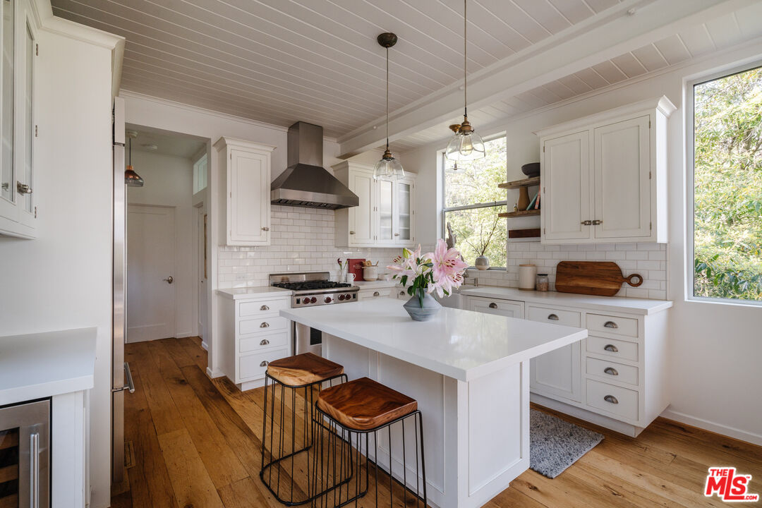 2355 Hermits Glen Los Angeles, CA 90046 - Photo 13 of 45 a kitchen with stainless steel appliances granite countertop a sink stove and refrigerator