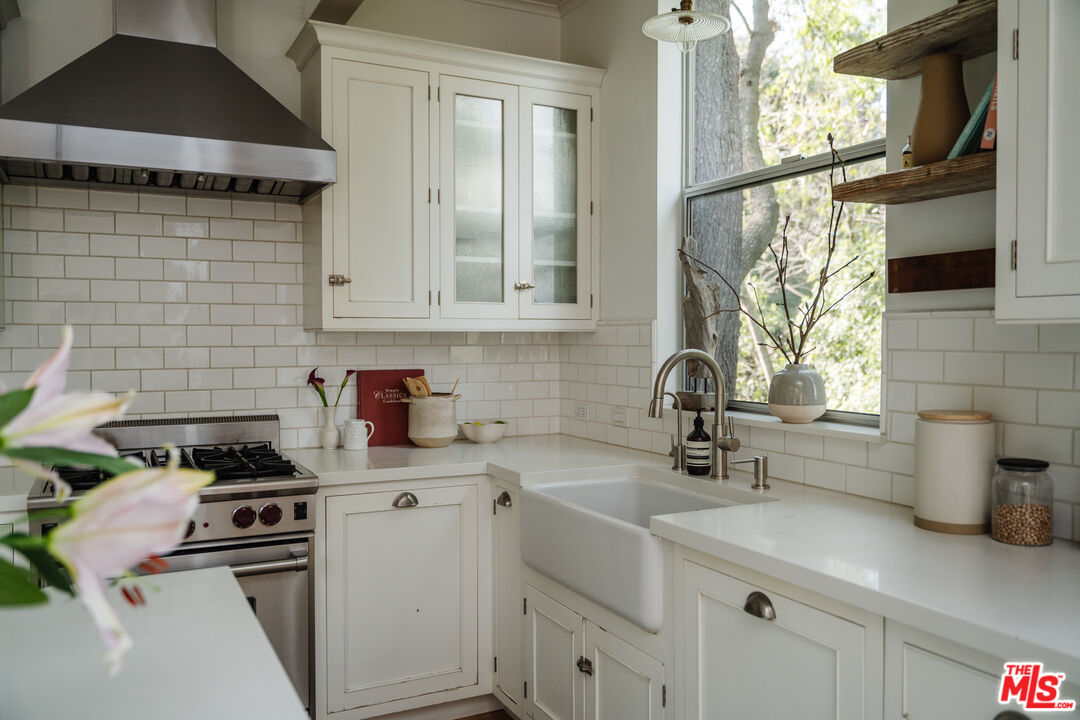 2355 Hermits Glen Los Angeles, CA 90046 - Photo 15 of 45 a kitchen with a sink cabinets and window