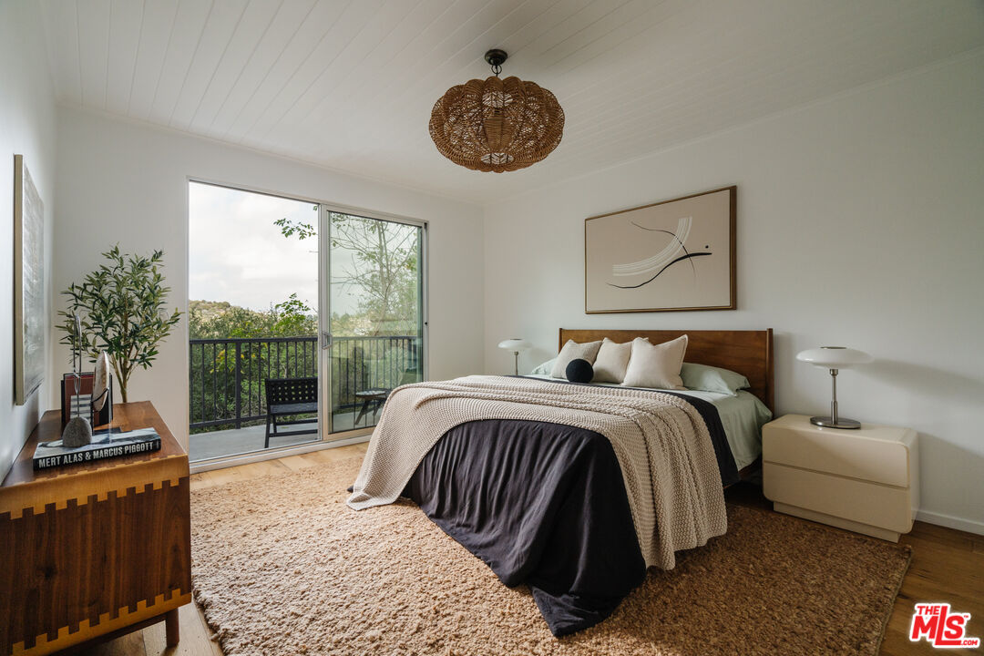2355 Hermits Glen Los Angeles, CA 90046 - Photo 18 of 45 a bedroom with a bed and a window
