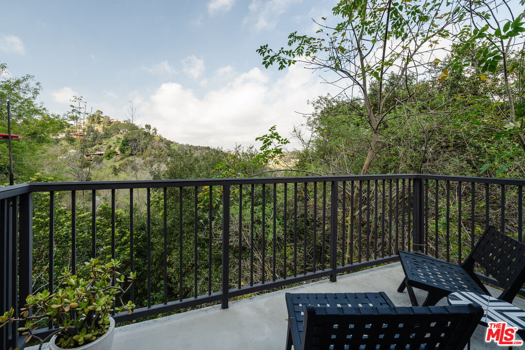 2355 Hermits Glen Los Angeles, CA 90046 - Photo 20 of 45 a balcony with wooden floor and outdoor space