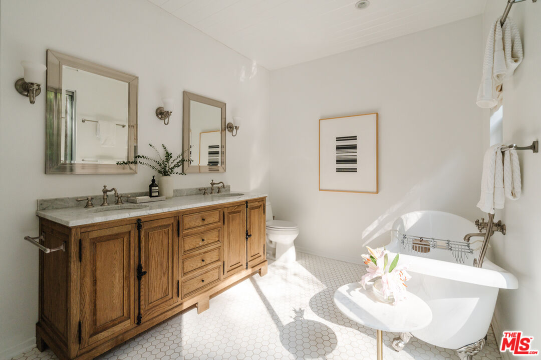 2355 Hermits Glen Los Angeles, CA 90046 - Photo 22 of 45 a bathroom with a sink double vanity and a mirror