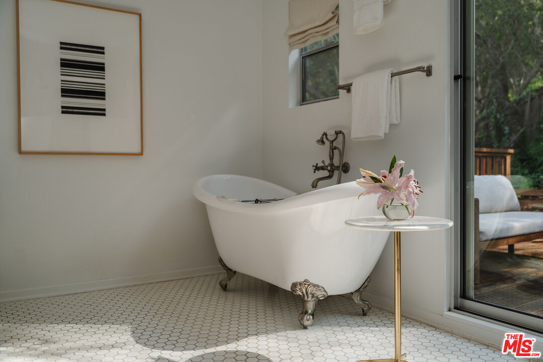 2355 Hermits Glen Los Angeles, CA 90046 - Photo 24 of 45 a white bath tub sitting next to a bathroom sink
