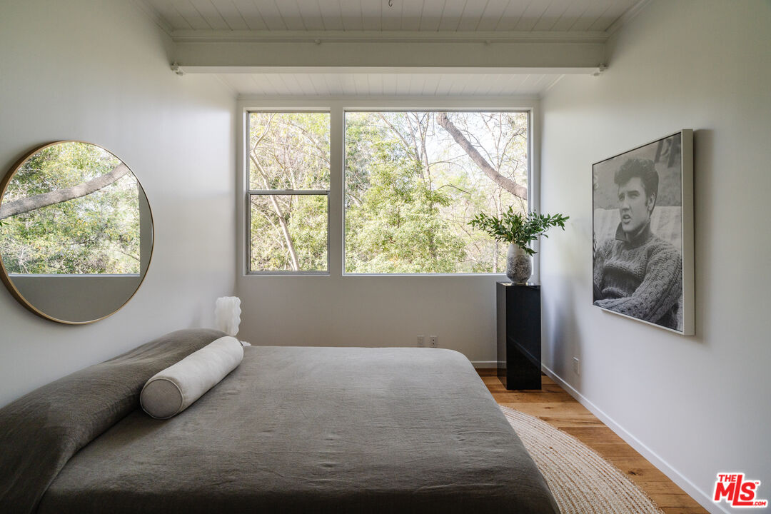 2355 Hermits Glen Los Angeles, CA 90046 - Photo 27 of 45 a bedroom with a bed and a window