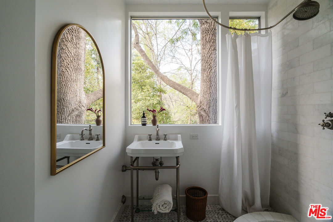 2355 Hermits Glen Los Angeles, CA 90046 - Photo 28 of 45 a view of a room that has a bed and a table in it