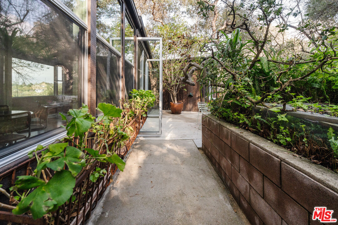 2355 Hermits Glen Los Angeles, CA 90046 - Photo 30 of 45 a view of a pathway that has a lot of flower plants