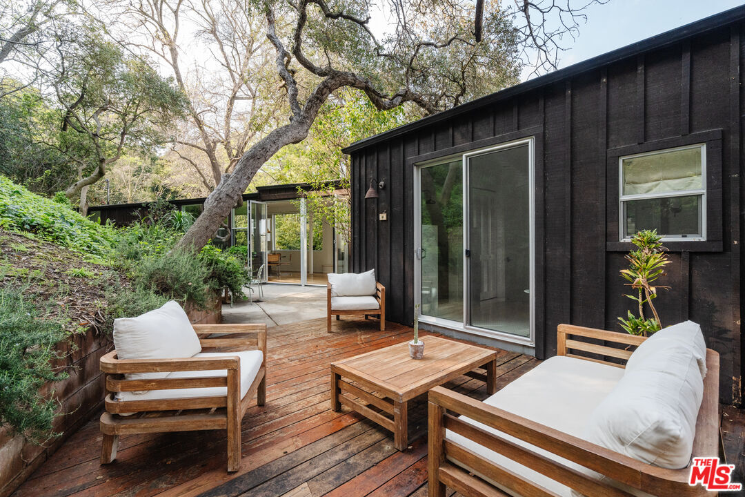 2355 Hermits Glen Los Angeles, CA 90046 - Photo 38 of 45 a view of a patio with wooden floor
