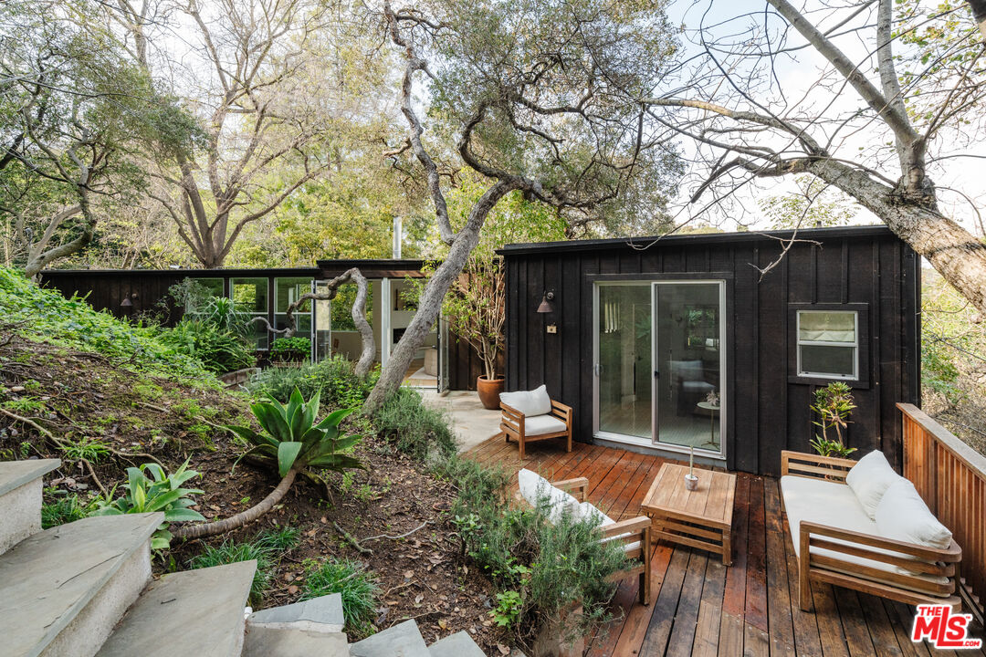 2355 Hermits Glen Los Angeles, CA 90046 - Photo 39 of 45 a view of a house with backyard sitting area and garden