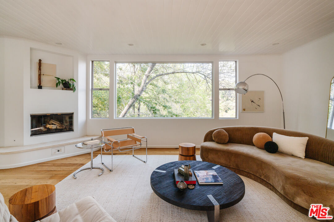 2355 Hermits Glen Los Angeles, CA 90046 - Photo 6 of 45 a living room with furniture and a fireplace
