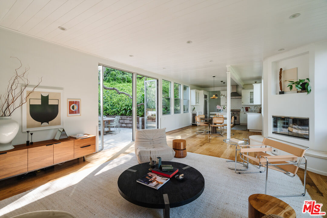 2355 Hermits Glen Los Angeles, CA 90046 - Photo 9 of 45 a room with furniture and a large window