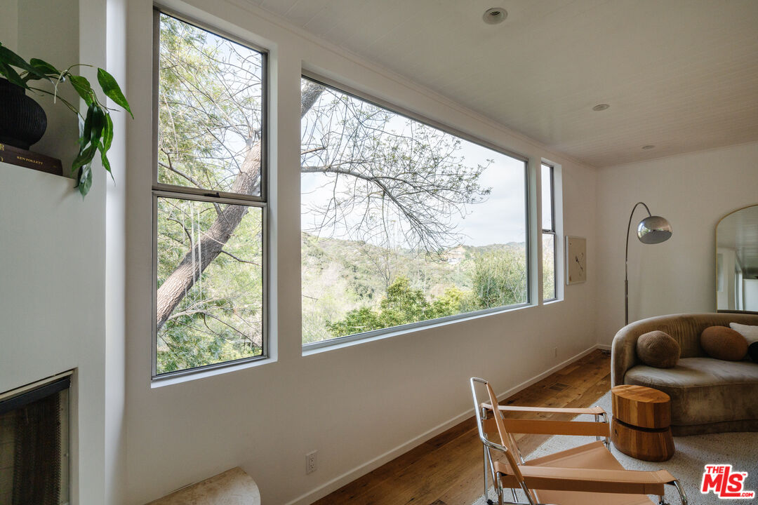 2355 Hermits Glen Los Angeles, CA 90046 - Photo 10 of 45 a living room with furniture and a window