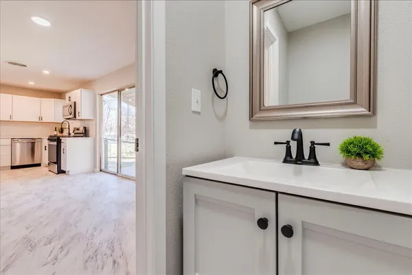 a view of a kitchen from the hallway