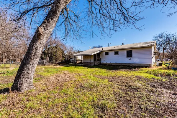 a front view of house with yard and seating area