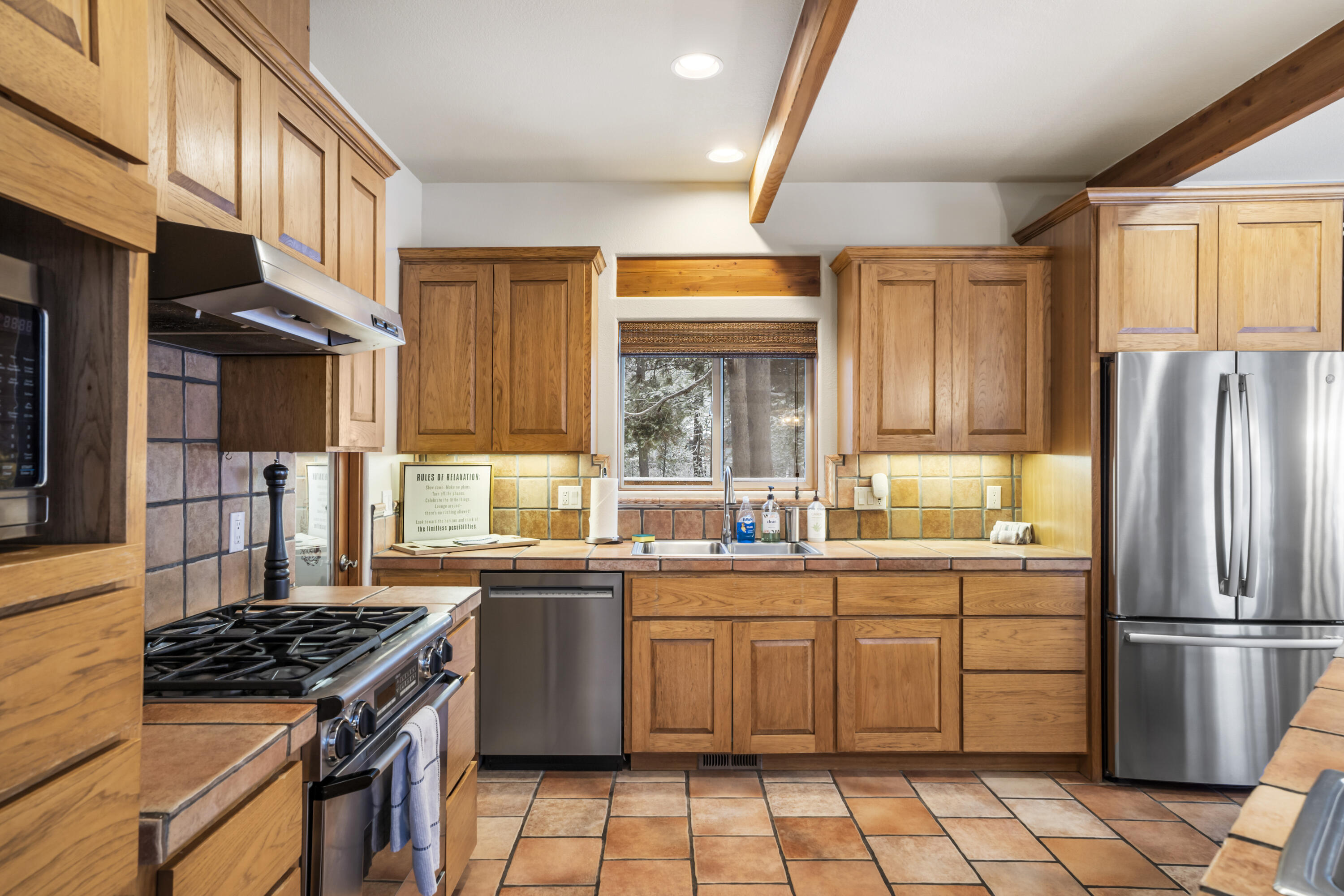 56065 Snow Goose Road Bend, OR 97707 - Photo 13 of 65 Plenty of room for everyone to gather around the kitchen/dining area to prepare and enjoy meals together!