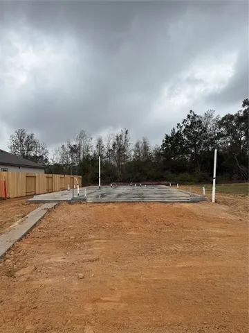 a picture of a bench in front of a wall