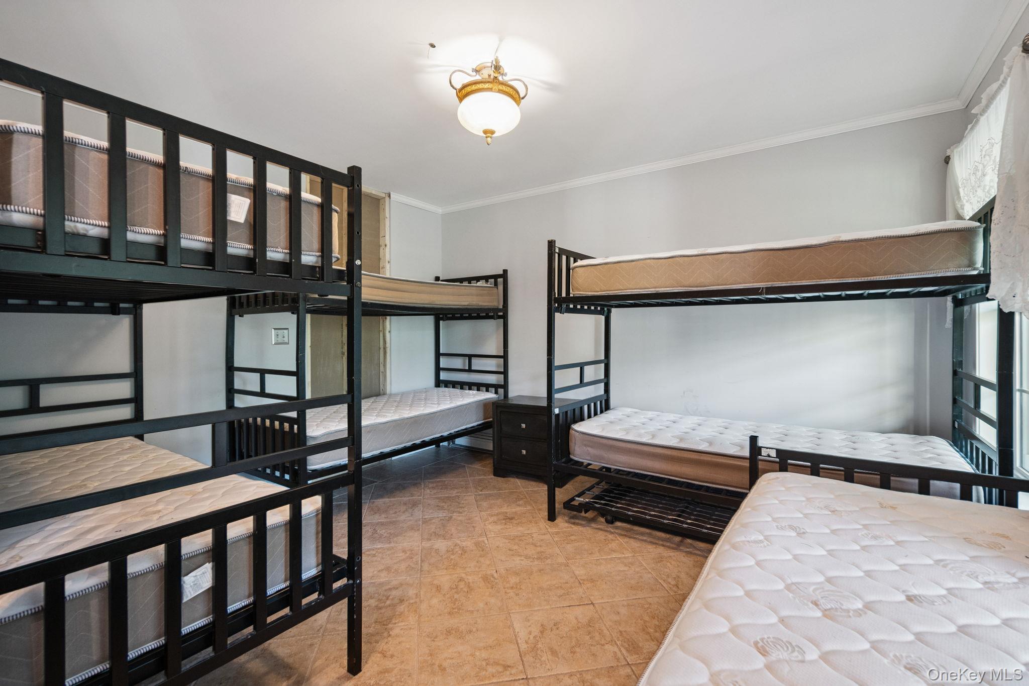 66 Highland Lake Road Eldred, NY 12732 - Photo 12 of 50 a bedroom with furniture and a window