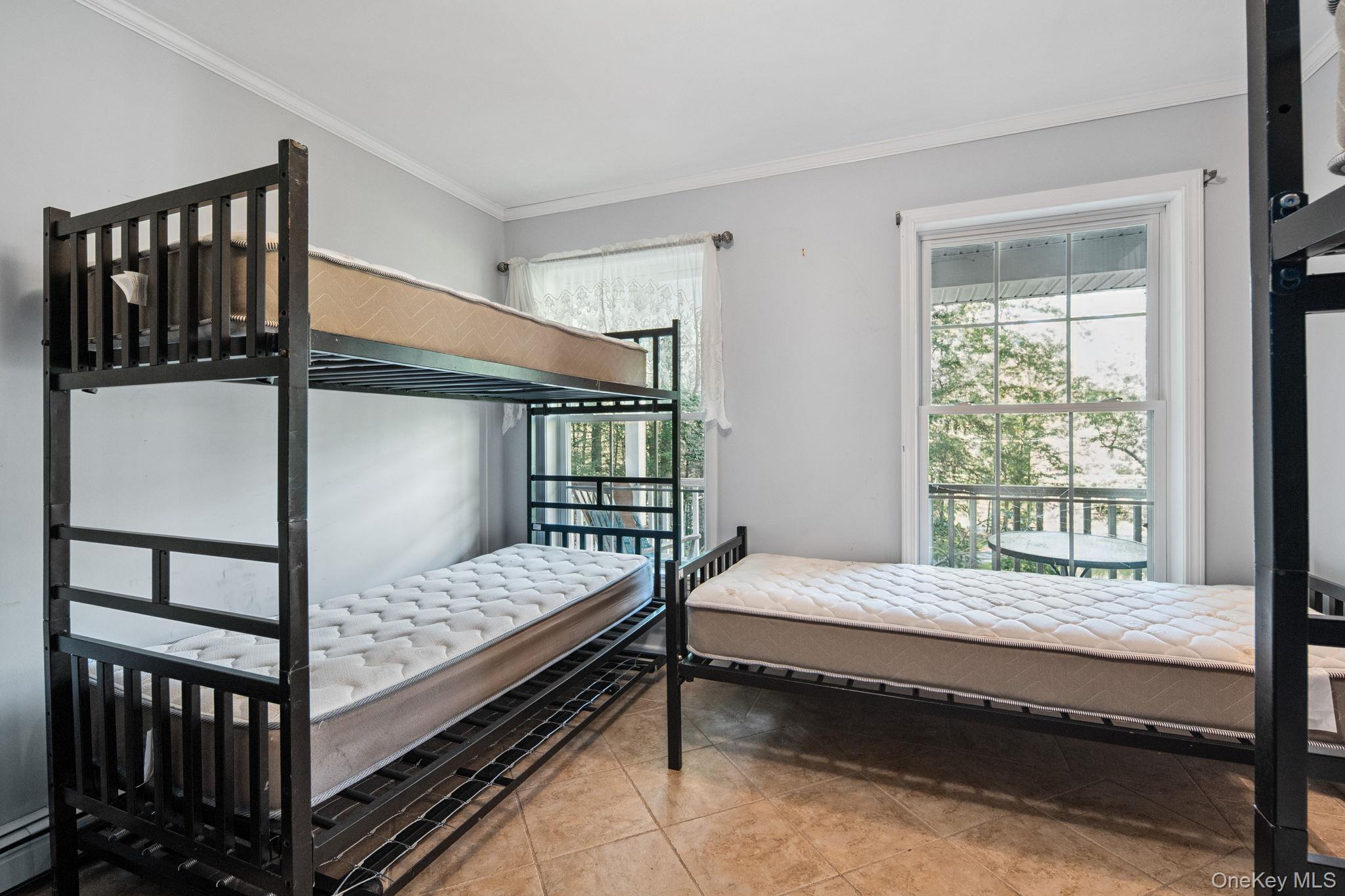 66 Highland Lake Road Eldred, NY 12732 - Photo 13 of 50 a bedroom with a bed and a window