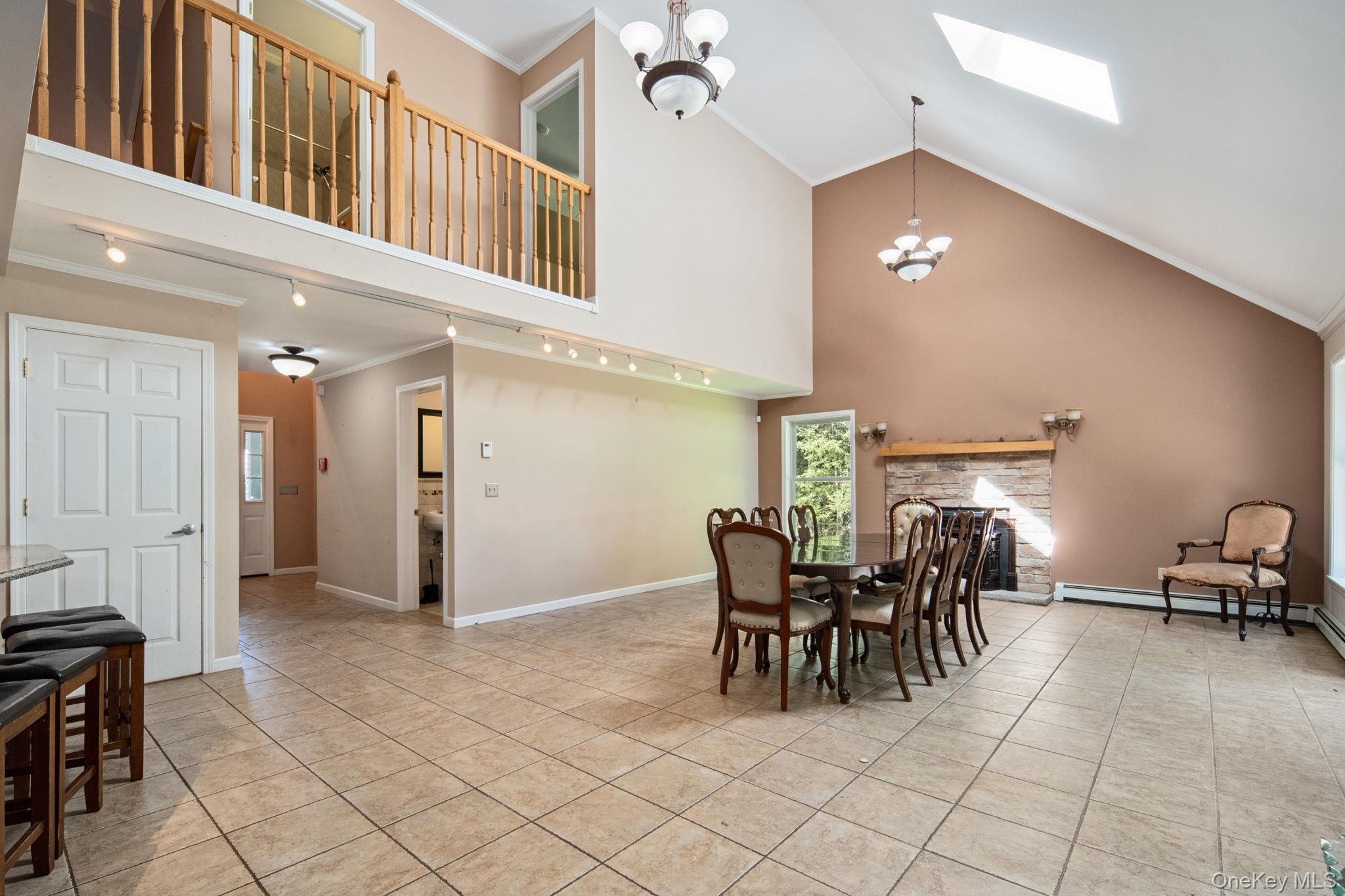 66 Highland Lake Road Eldred, NY 12732 - Photo 14 of 50 a view of a dining room with furniture and chandelier