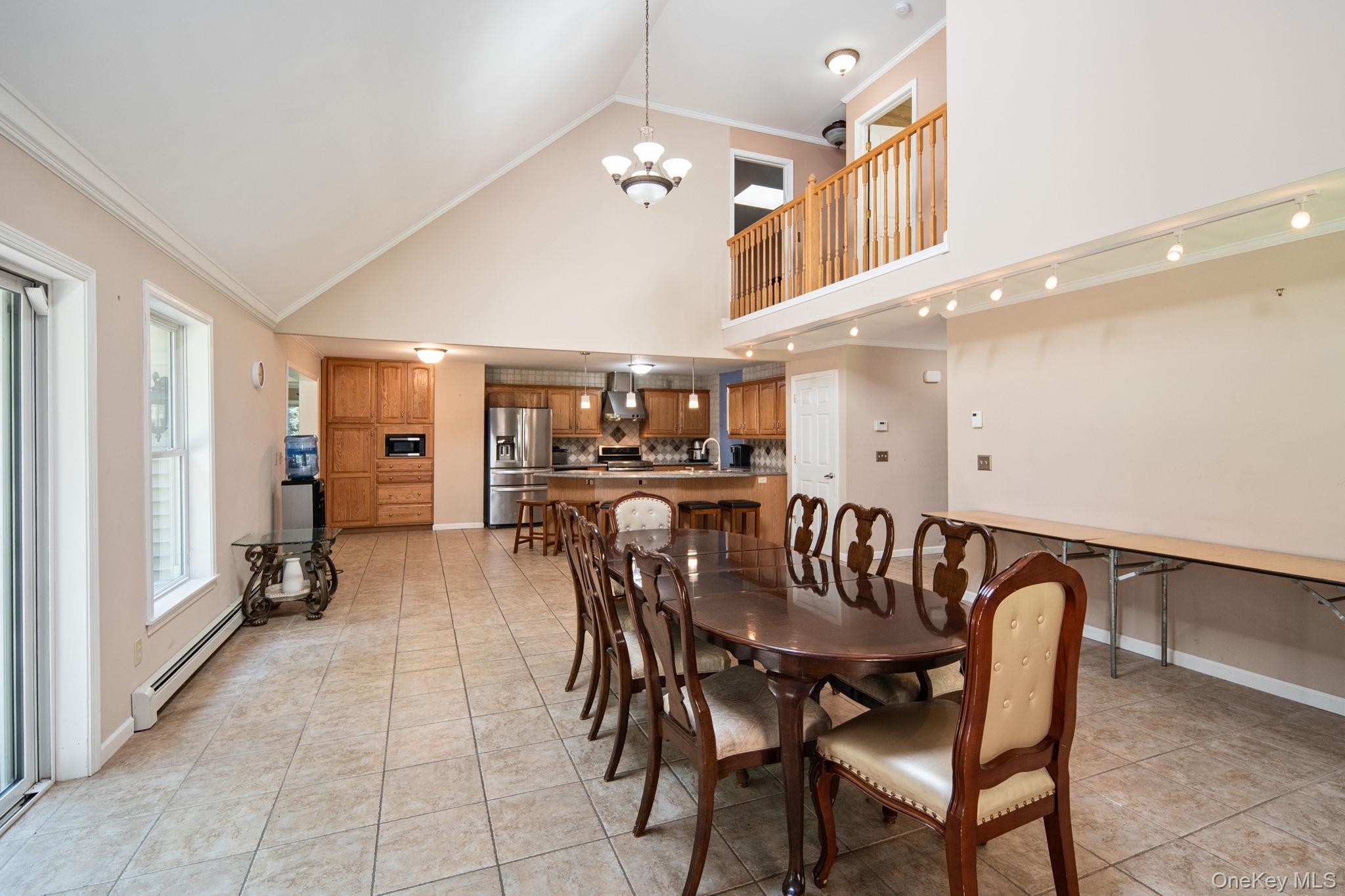 66 Highland Lake Road Eldred, NY 12732 - Photo 15 of 50 a view of a dining room with furniture and a kitchen view