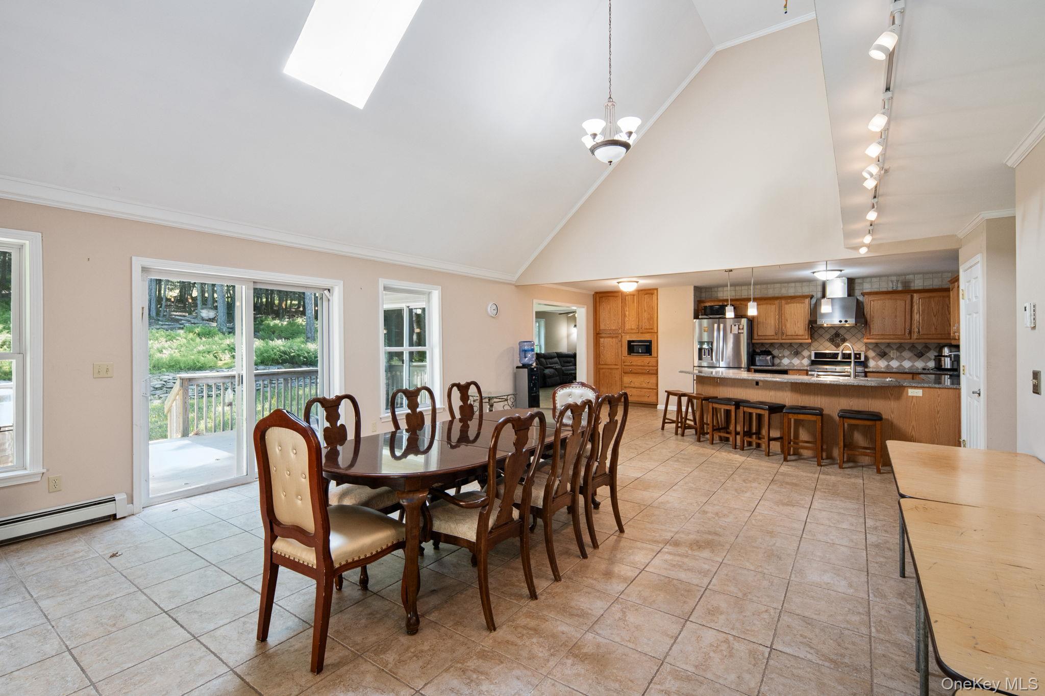 66 Highland Lake Road Eldred, NY 12732 - Photo 16 of 50 a view of a dining room with furniture and a livingroom