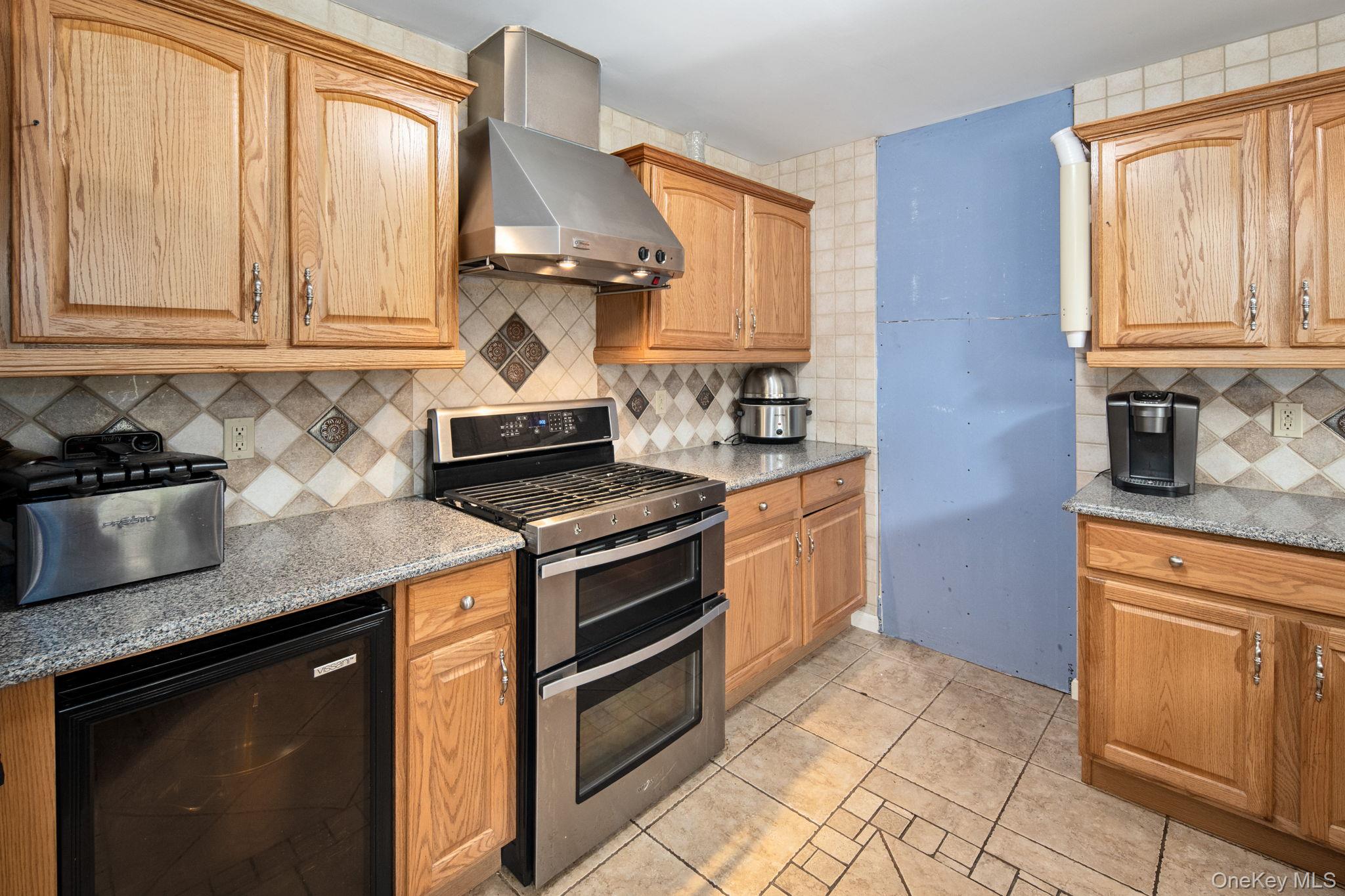 66 Highland Lake Road Eldred, NY 12732 - Photo 19 of 50 a kitchen with stainless steel appliances granite countertop a sink stove and microwave