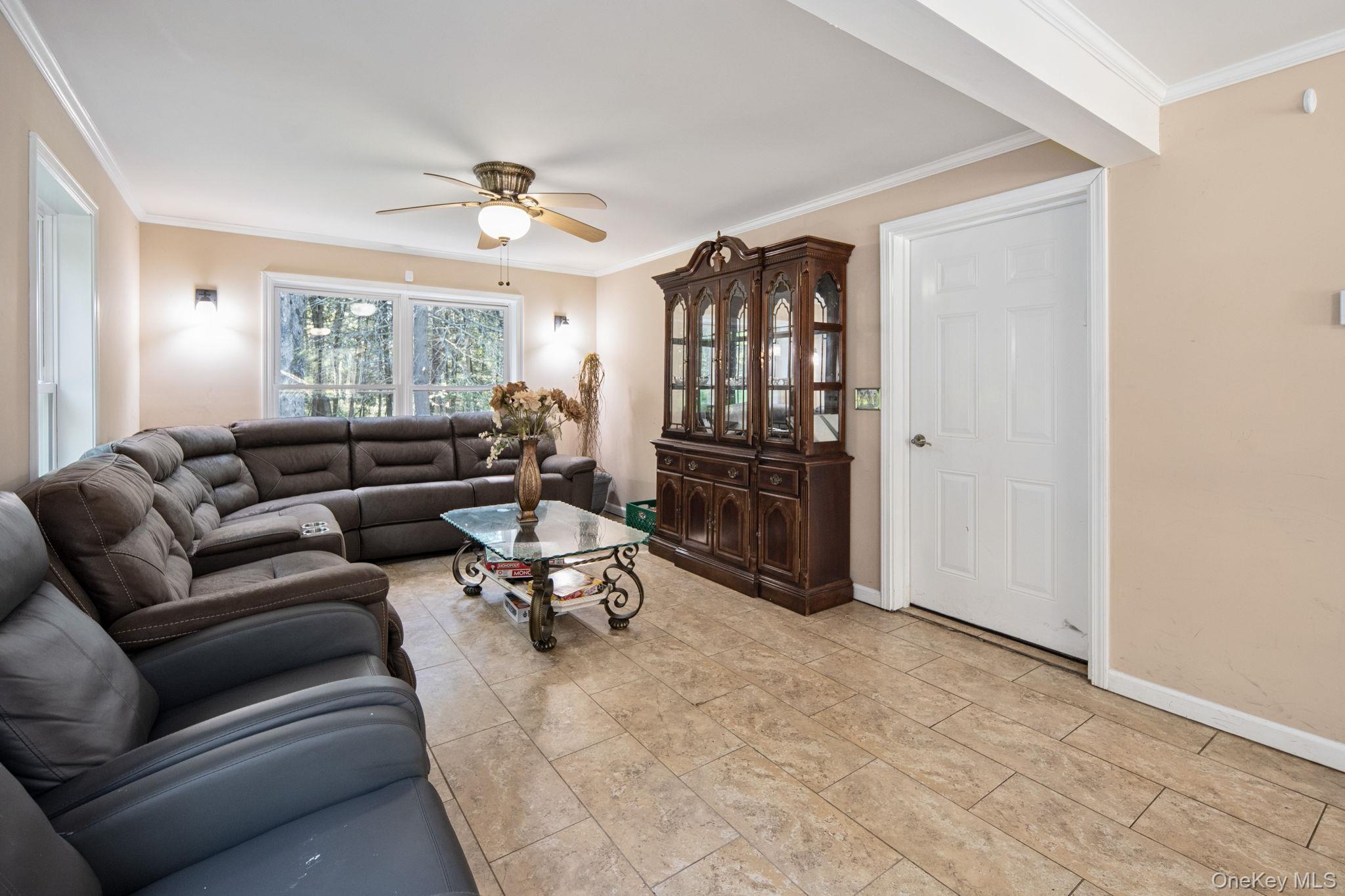 66 Highland Lake Road Eldred, NY 12732 - Photo 25 of 50 a living room with furniture a dining table and a window