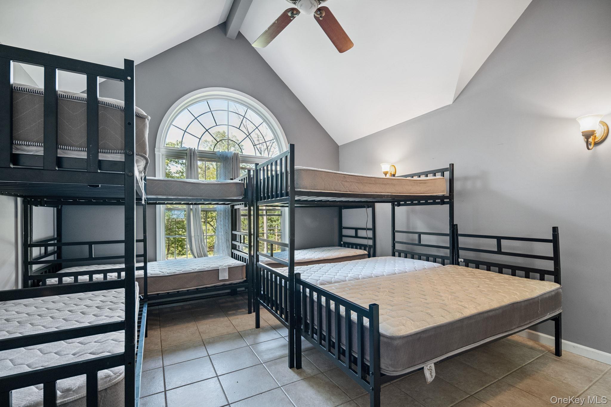 66 Highland Lake Road Eldred, NY 12732 - Photo 28 of 50 a bed room with a bed and a large window