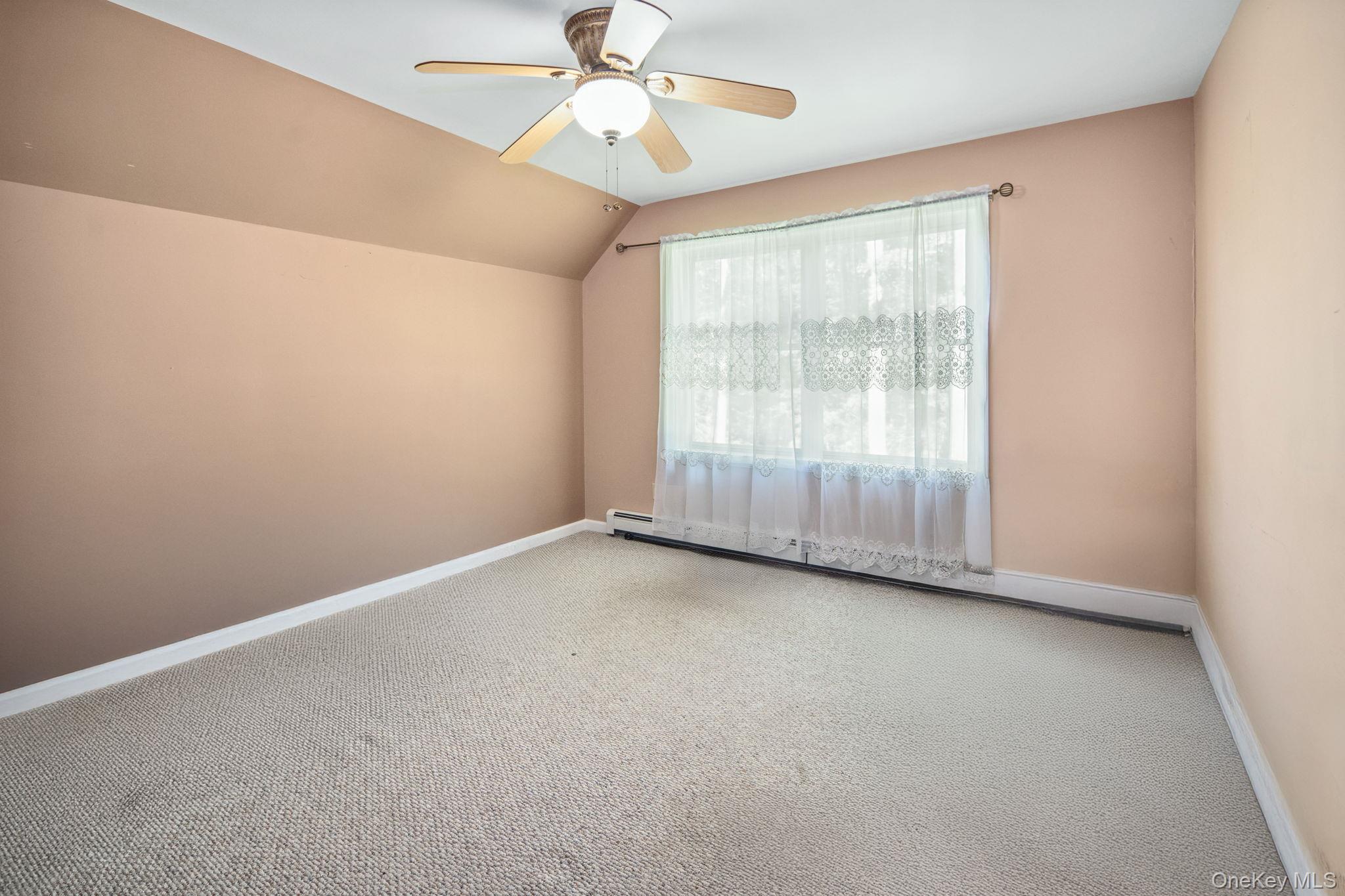 66 Highland Lake Road Eldred, NY 12732 - Photo 38 of 50 an empty room with a window and a fan