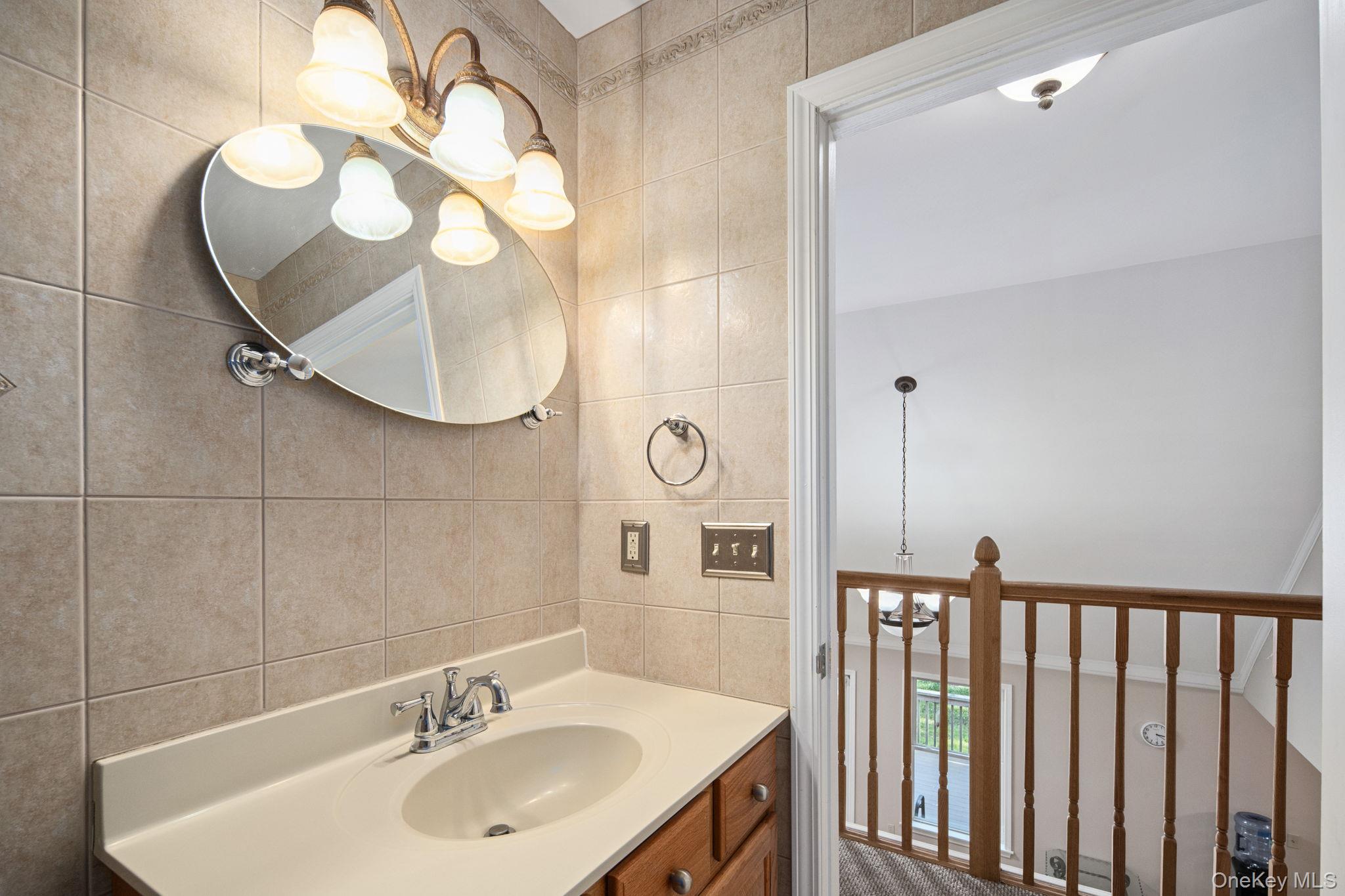 66 Highland Lake Road Eldred, NY 12732 - Photo 41 of 50 a bathroom with a sink and mirror