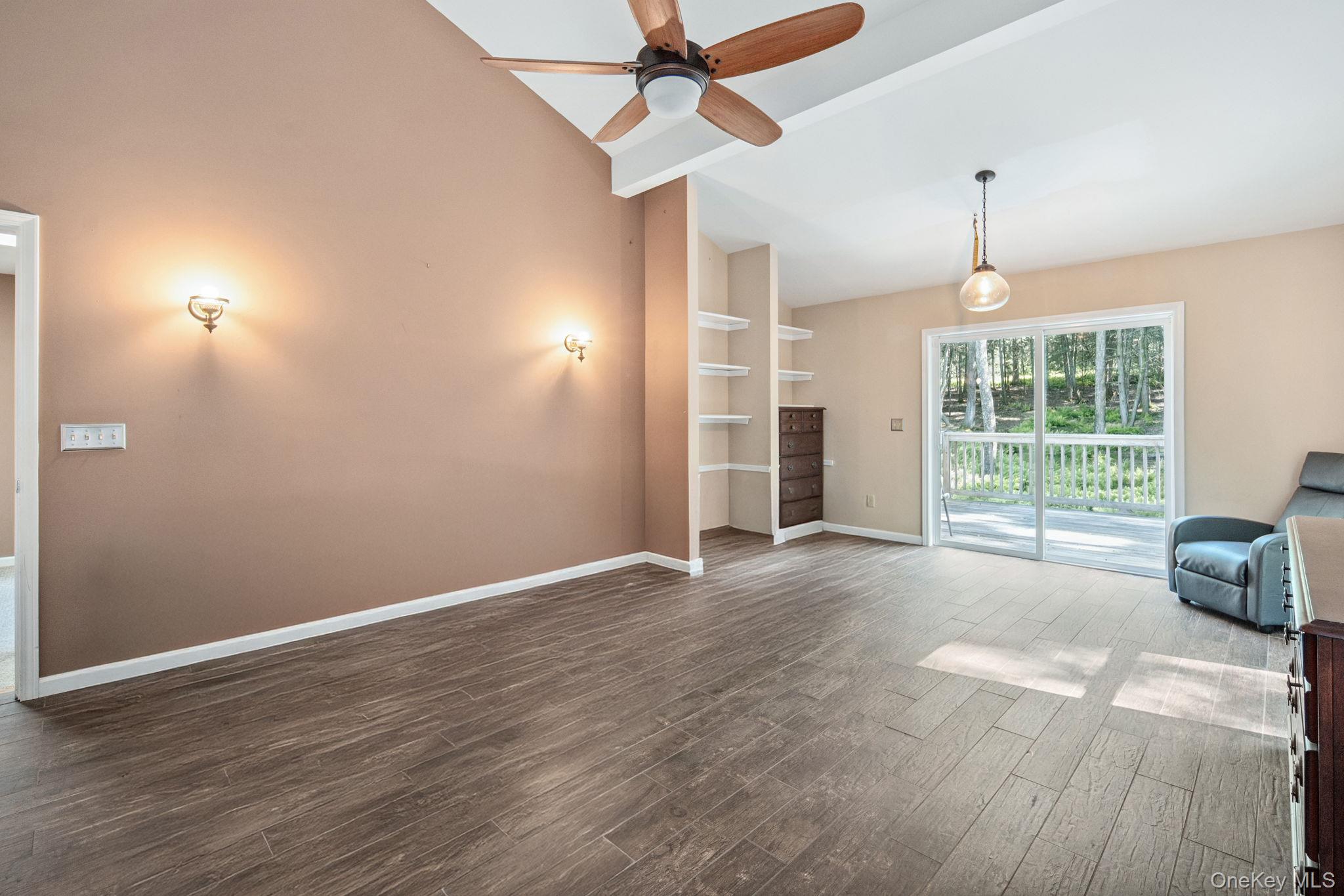 66 Highland Lake Road Eldred, NY 12732 - Photo 45 of 50 a view of livingroom with hardwood floor and a ceiling fan