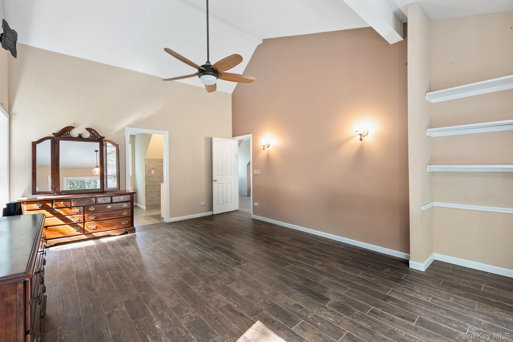 66 Highland Lake Road Eldred, NY 12732 - Photo 47 of 50 a view of an empty room with stairs and a ceiling fan