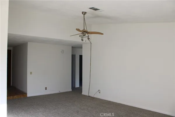 a view of a room with a hanging light