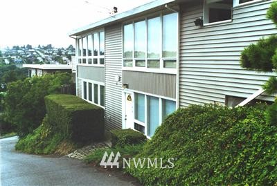 2513 13th Avenue West Seattle, WA 98119 - Photo 1 of 1 a view of a chair and table in the balcony