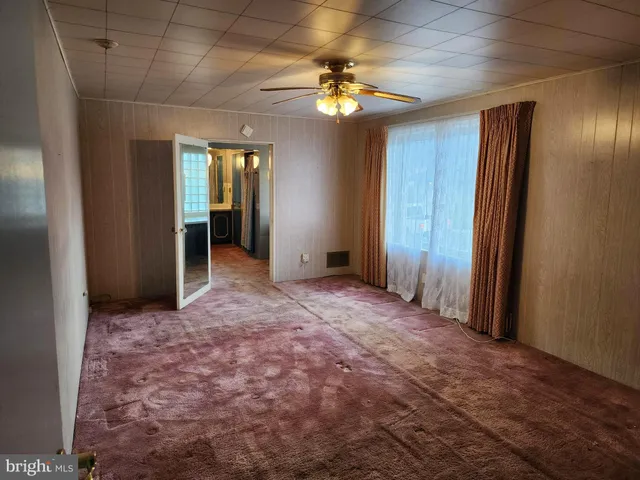 a kitchen with a stove a sink and a microwave