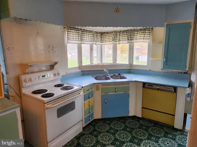 a kitchen with a stove and a sink