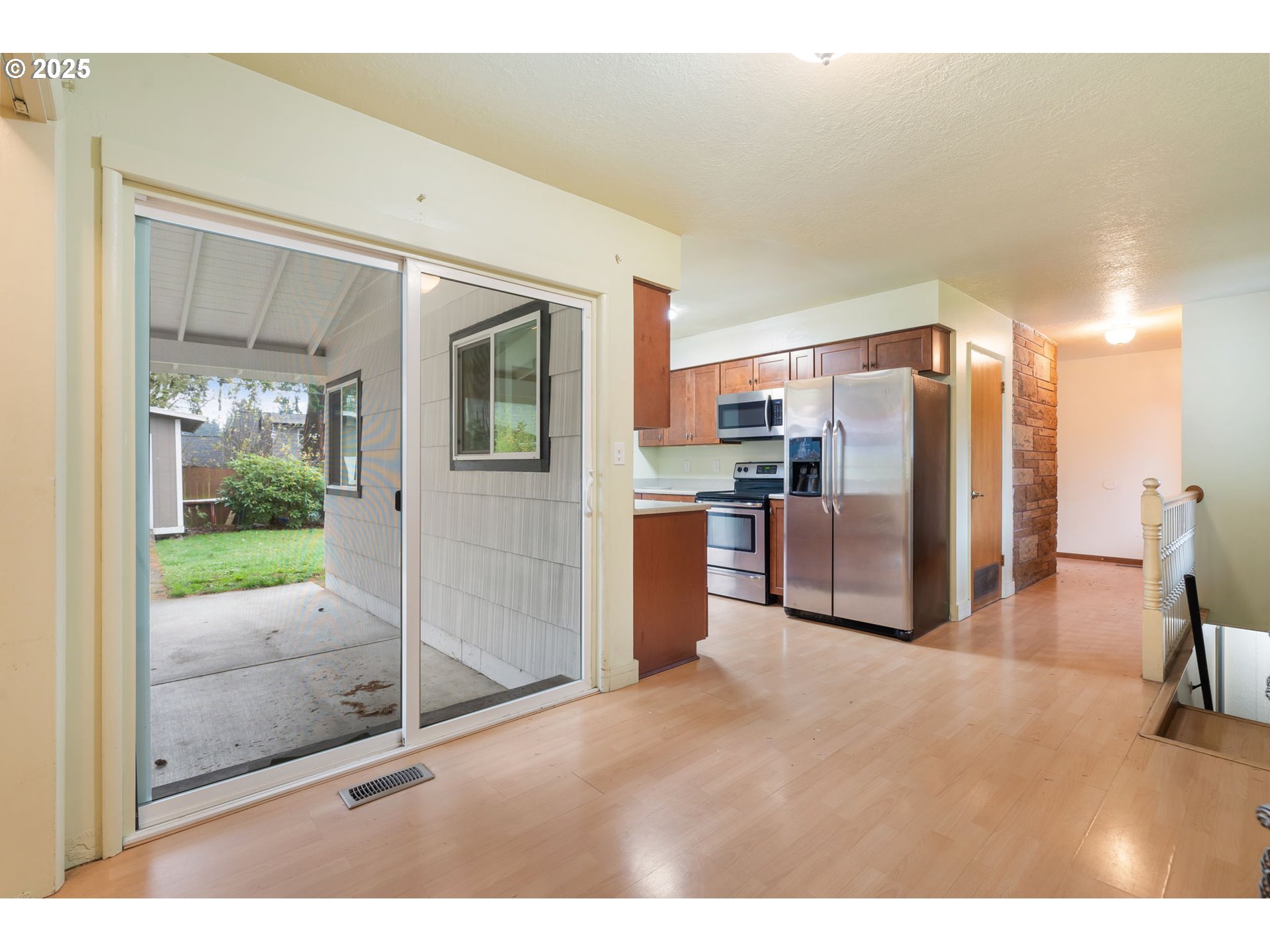 11010 Southeast Salmon Street Portland, OR 97216 - Photo 17 of 42 a open kitchen with refrigerator stove and large window