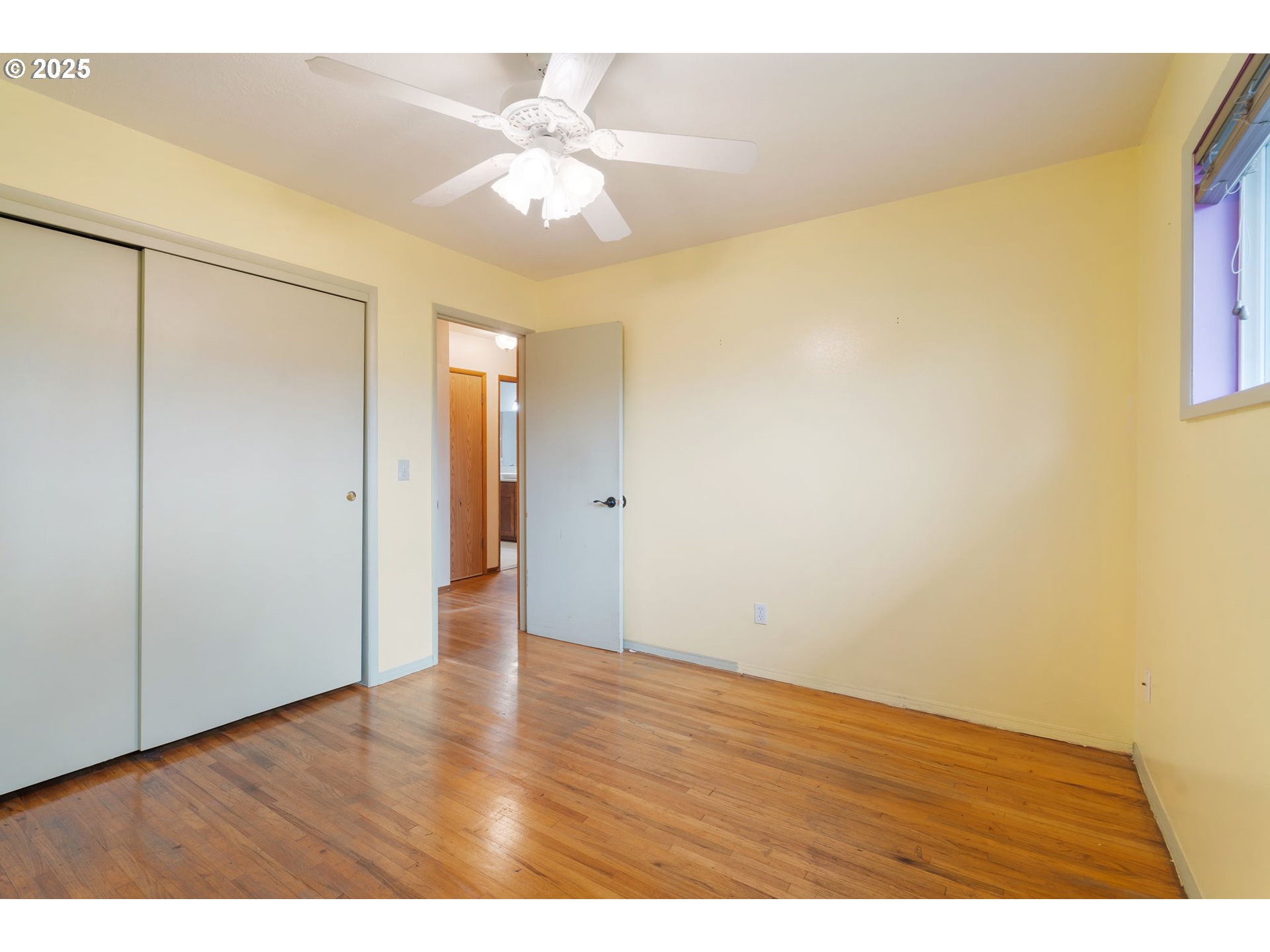 11010 Southeast Salmon Street Portland, OR 97216 - Photo 22 of 42 a view of an empty room with wooden floor