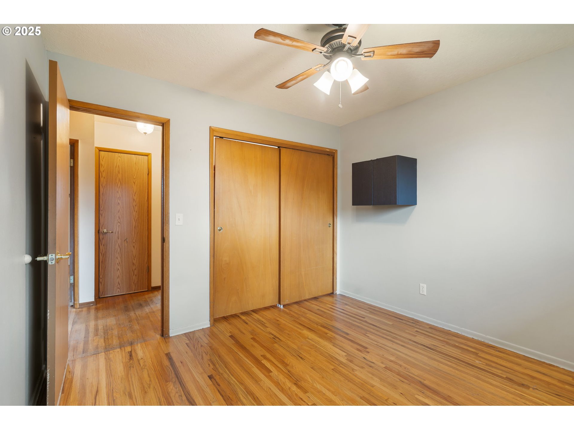 11010 Southeast Salmon Street Portland, OR 97216 - Photo 28 of 42 a view of an empty room with wooden floor