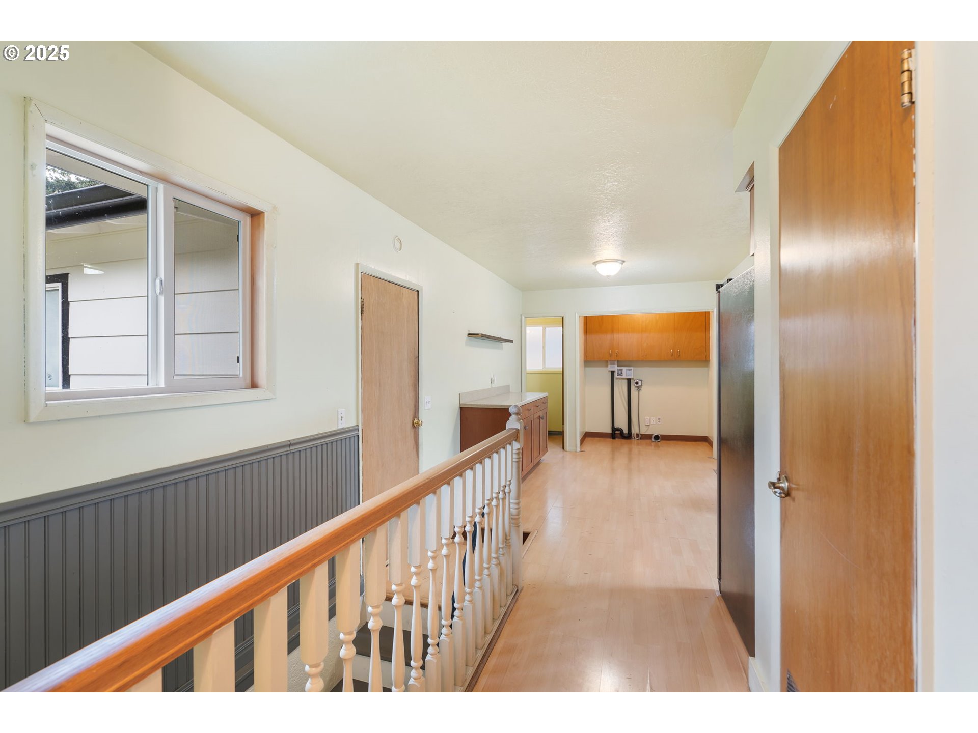 11010 Southeast Salmon Street Portland, OR 97216 - Photo 33 of 42 a view of a hallway view with wooden floor and staircase