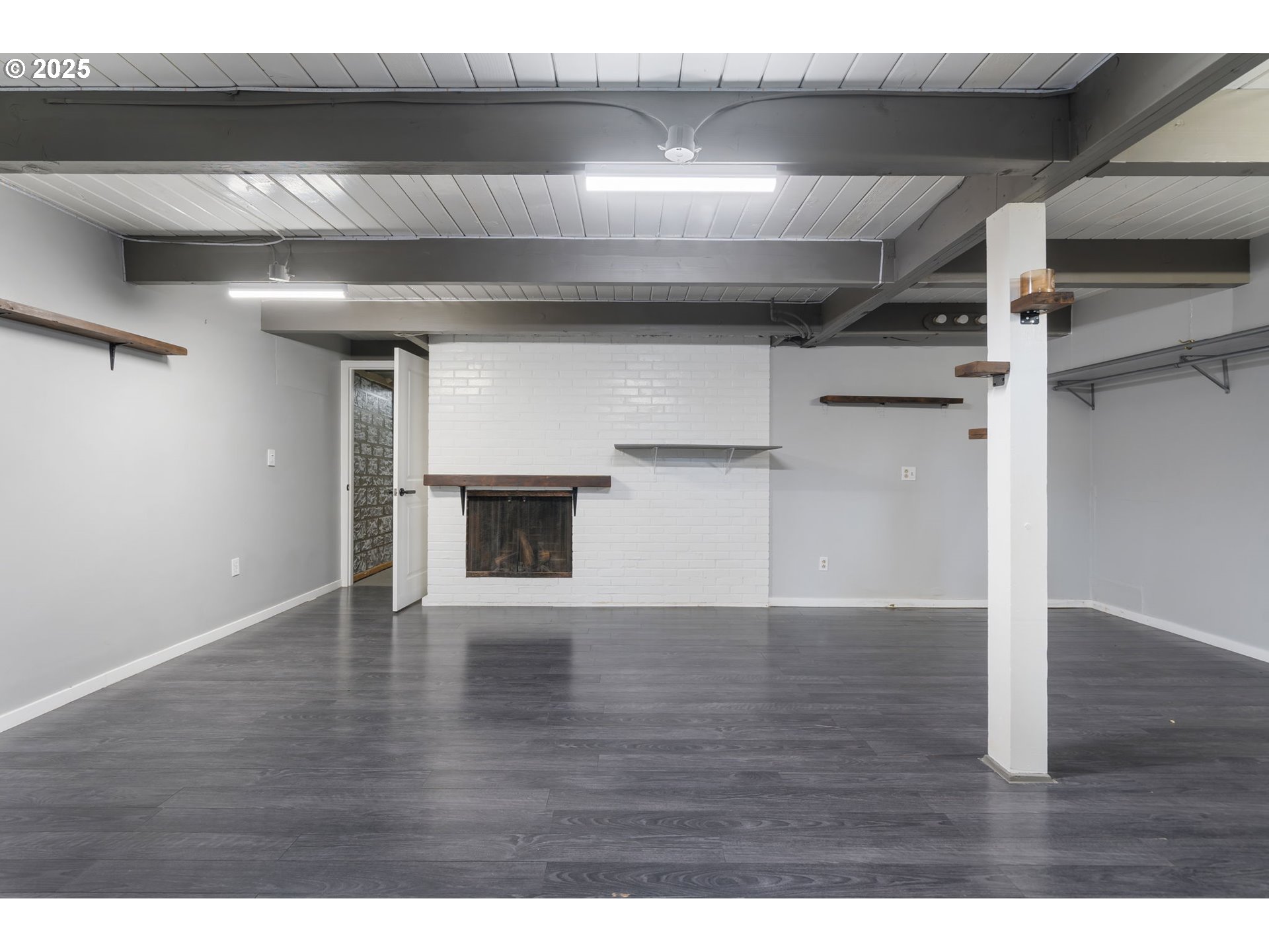 11010 Southeast Salmon Street Portland, OR 97216 - Photo 36 of 42 a view of empty room with wooden floor