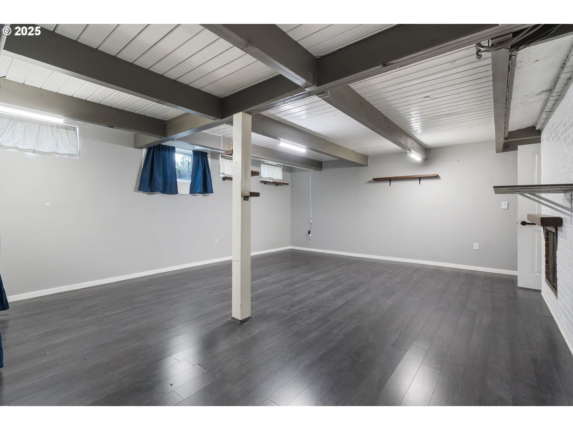 11010 Southeast Salmon Street Portland, OR 97216 - Photo 37 of 42 a view of an empty room with wooden floor