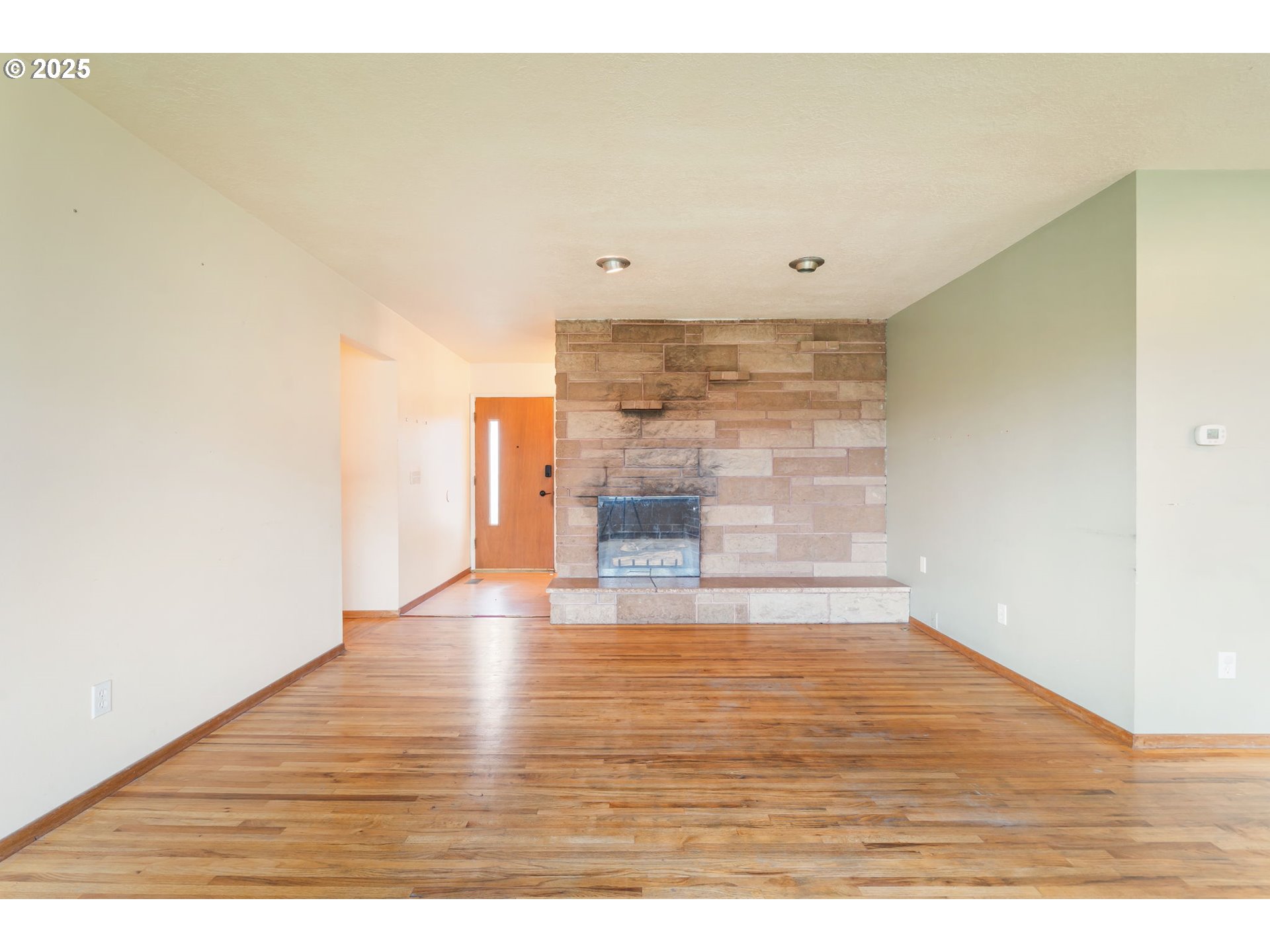 11010 Southeast Salmon Street Portland, OR 97216 - Photo 5 of 42 a view of empty room with wooden floor