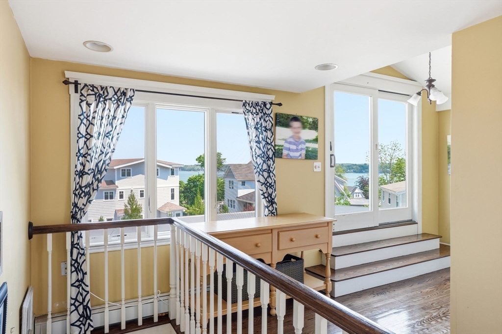 3 Talbot Road Hingham, MA 02043 - Photo 18 of 34 a view of a porch with a wooden floor and windows