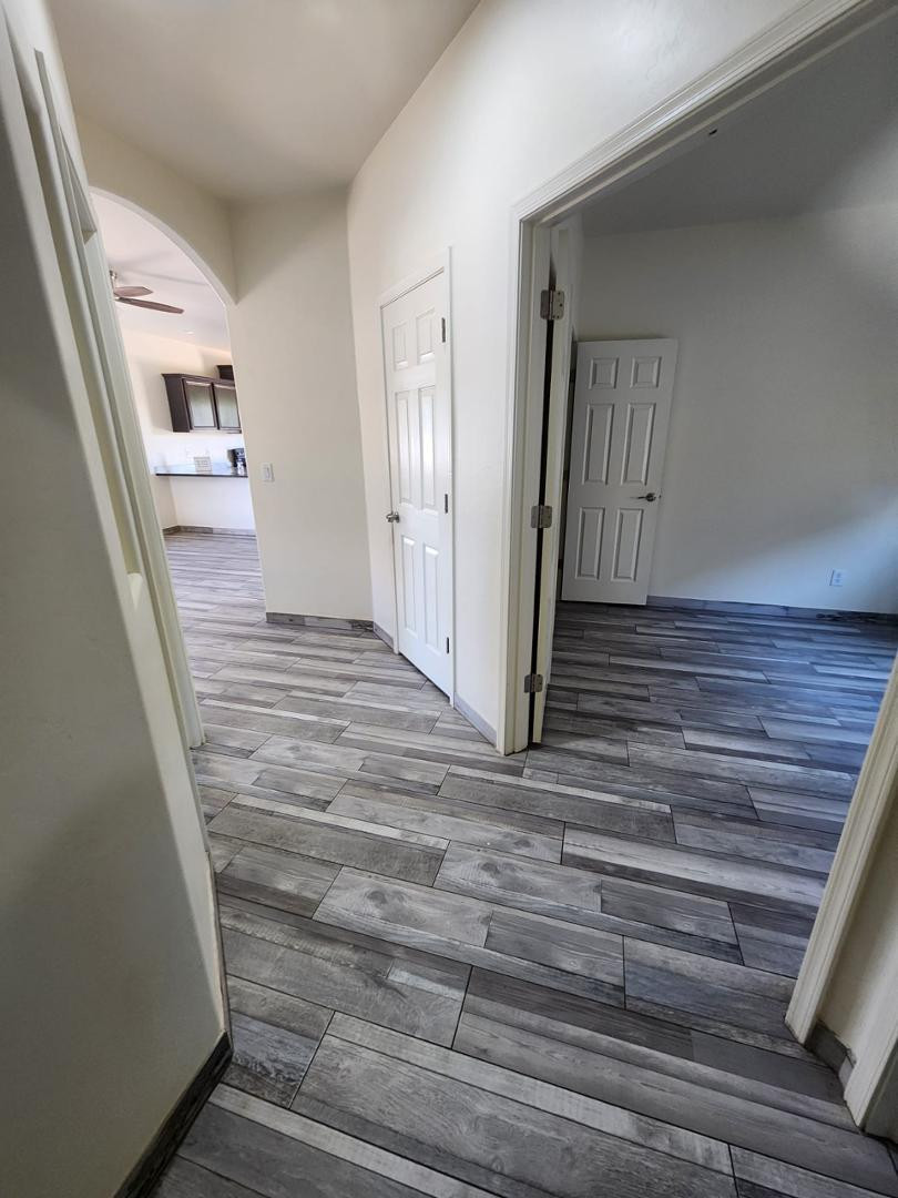 3641 Camino Del Rancho Douglas, AZ 85607 - Photo 4 of 20 a view of a hallway with wooden floor and entryway