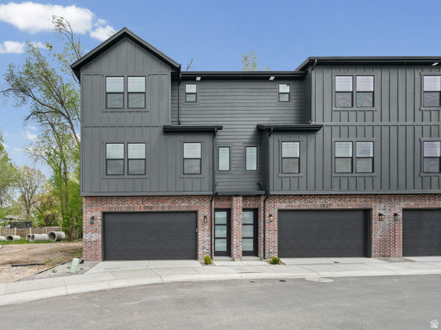 340 East 7635 S Street Sandy, UT 84047 - Photo 1 of 32 Modern inspired farmhouse with board and batten siding, an attached garage, driveway, and brick siding