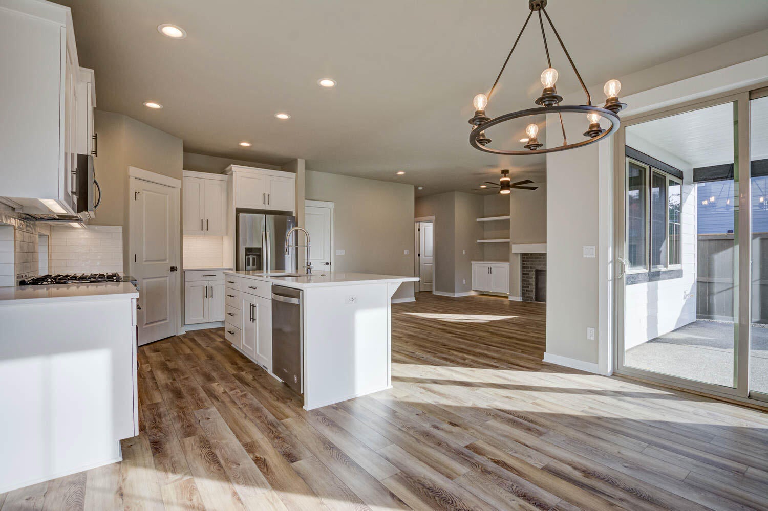 4652 Southwest 36th Street Redmond, OR 97756 - Photo 14 of 36 Kitchen and dining area. Greatroom. Example photo only. Some upgrades may be present. Specs and finishes vary. Refrigerator is not included.