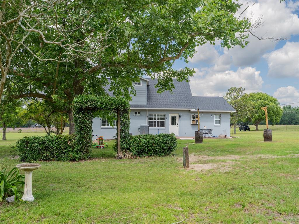 4381 Northeast 105th Place Anthony, FL 32617 - Photo 43 of 49 a front view of a house with a yard