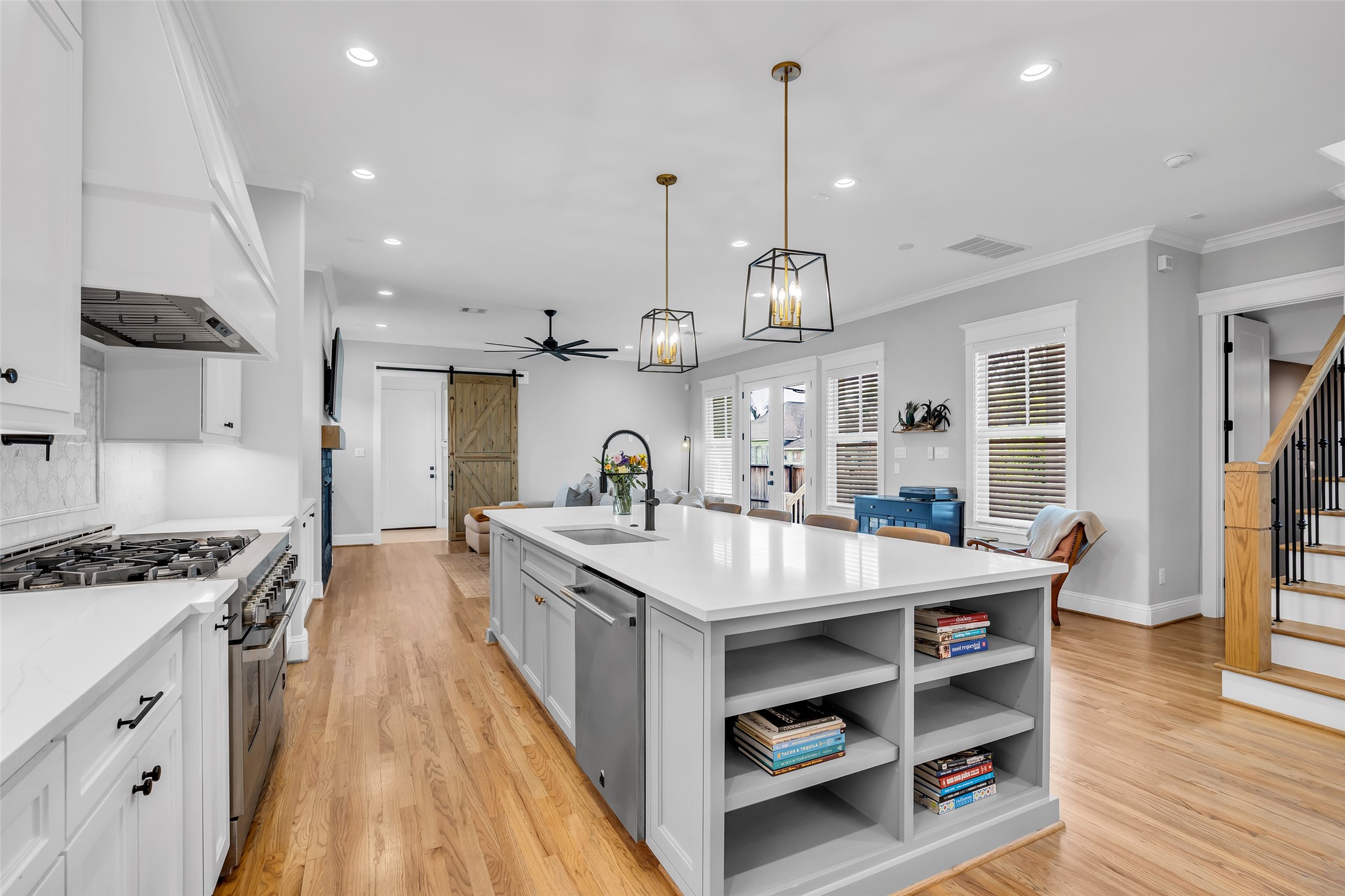 800 Walton Street Houston, TX 77009 - Photo 12 of 38 Both ends of the kitchen island include additional storage, offering extra space for cookware, utensils, and other kitchen essentials.