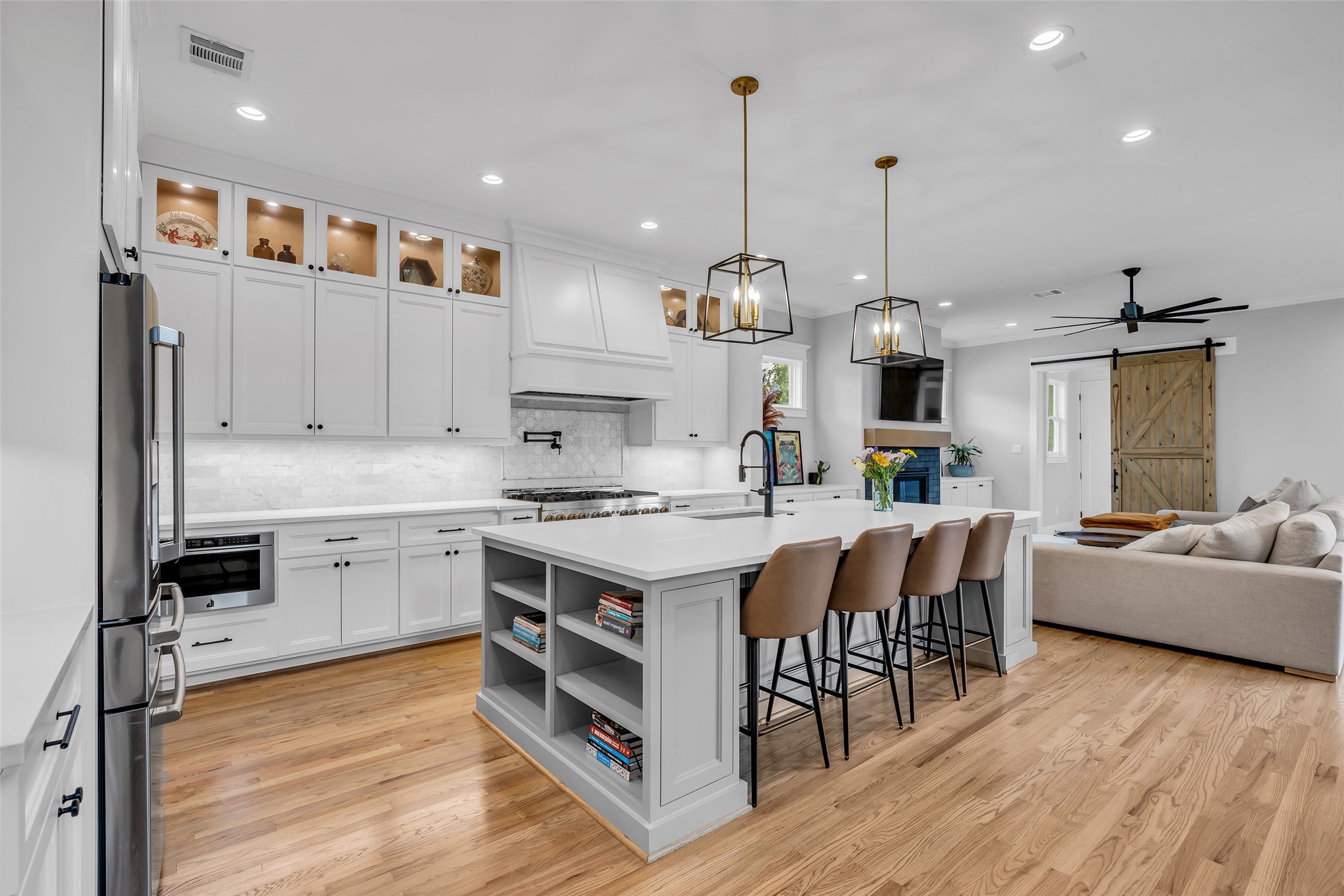 800 Walton Street Houston, TX 77009 - Photo 14 of 38 The kitchen island doubles as a breakfast bar, providing a casual spot for meals, snacks, or socializing while cooking.