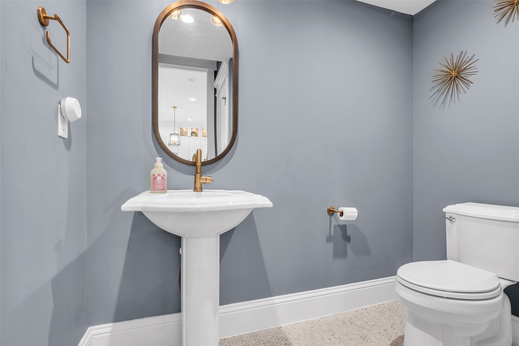 800 Walton Street Houston, TX 77009 - Photo 22 of 38 First-floor half bath features modern finishes, combining style and functionality for guests and everyday use.